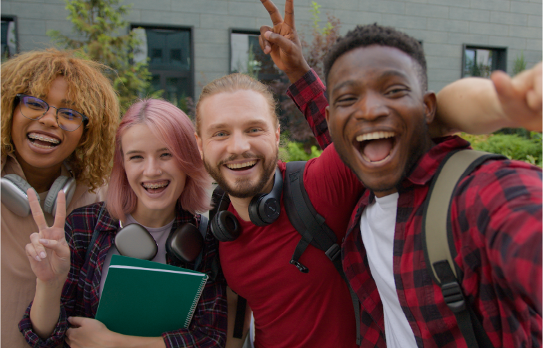 Group of close college aged friends huddled together closely